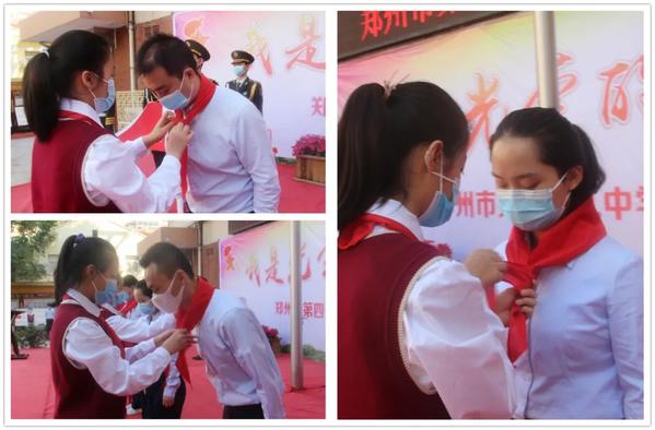 学生代表为辅导员老师戴上鲜艳的红领巾 学生代表为辅导员老师戴上鲜艳的红领巾