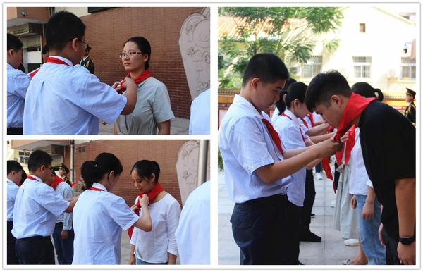 学生代表为辅导员老师戴上鲜艳的红领巾 学生代表为辅导员老师戴上鲜艳的红领巾